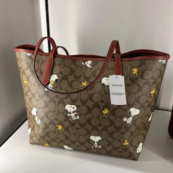 Coach X Peanuts City Tote In Signature Canvas With Snoopy Woodstock Print